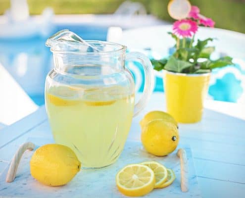 Picture showing jug of lemonade and lemons