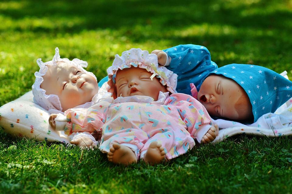 dolls on a grass