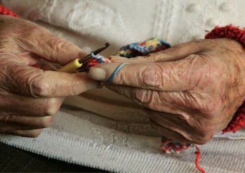 Elderly knitting in care home