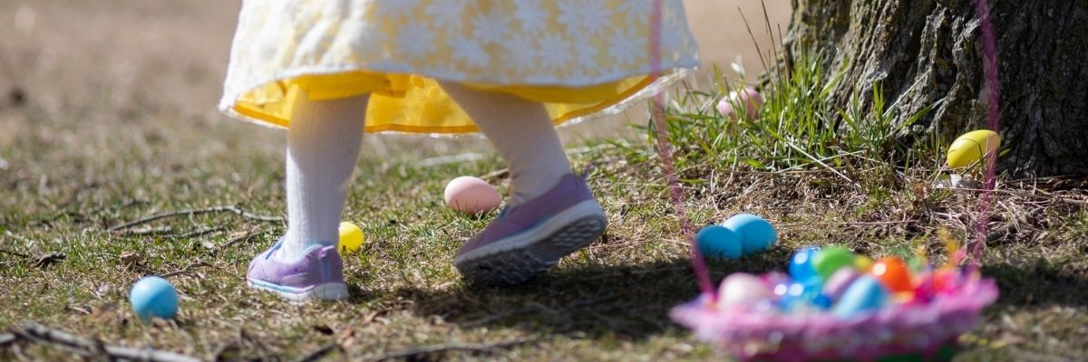 Girl looking for hidden Easter eggs