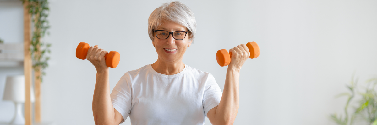 Elderly woman with weights