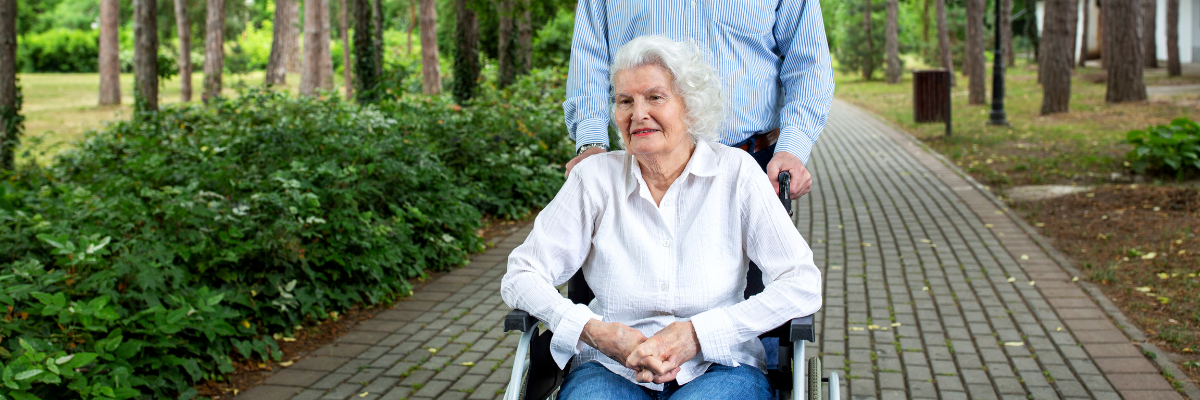 Elderly woman outside on a wheelchair