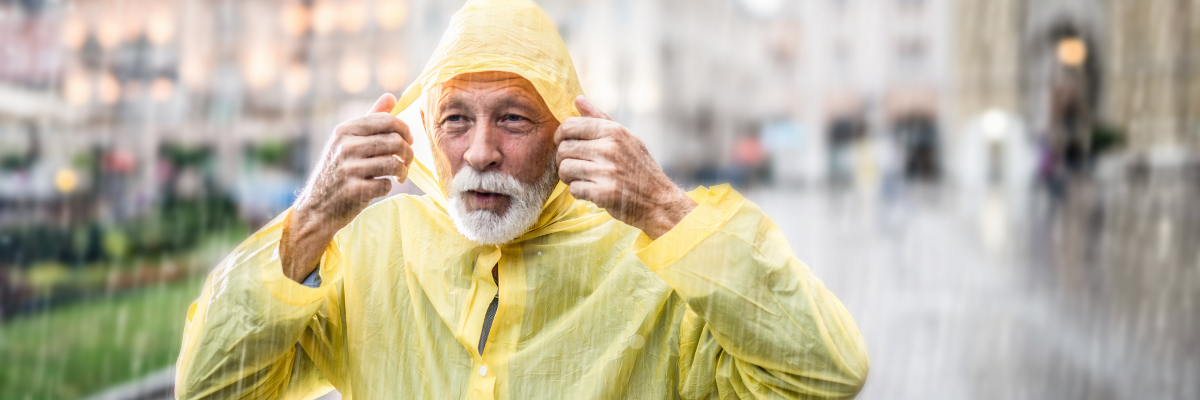 Senior man in the rain